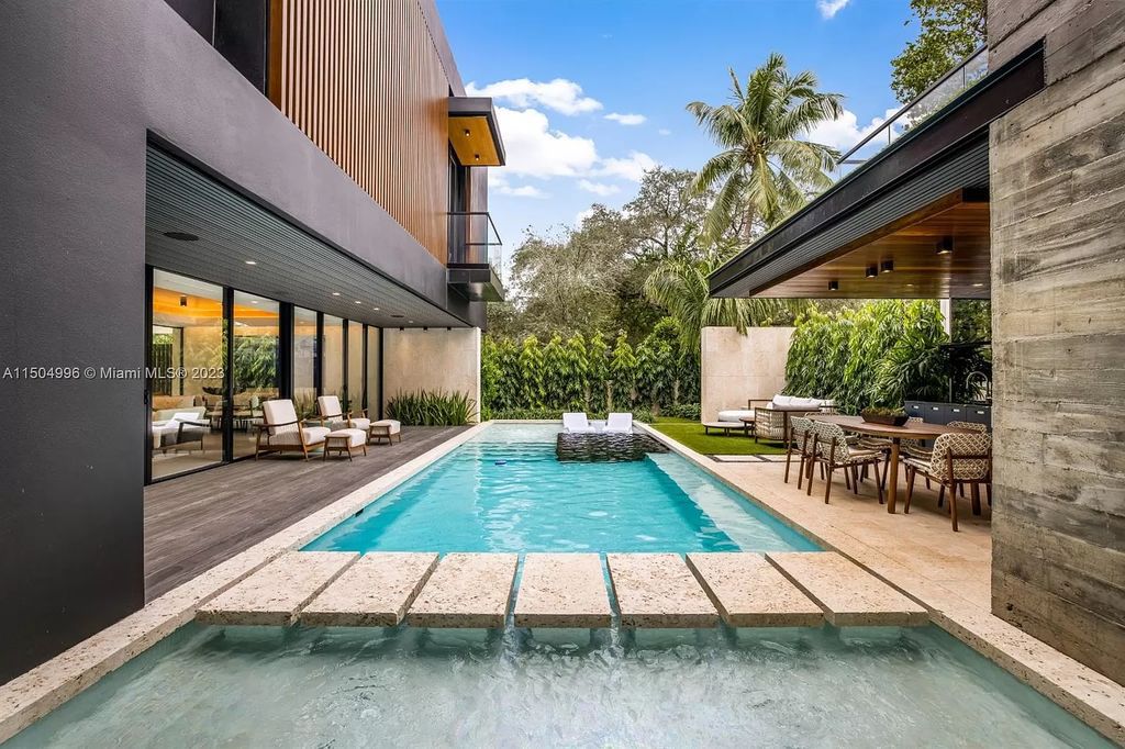 Discover the epitome of tropical luxury living at the Sir Crawford residence in Miami, perfectly situated near top schools and Grove amenities.