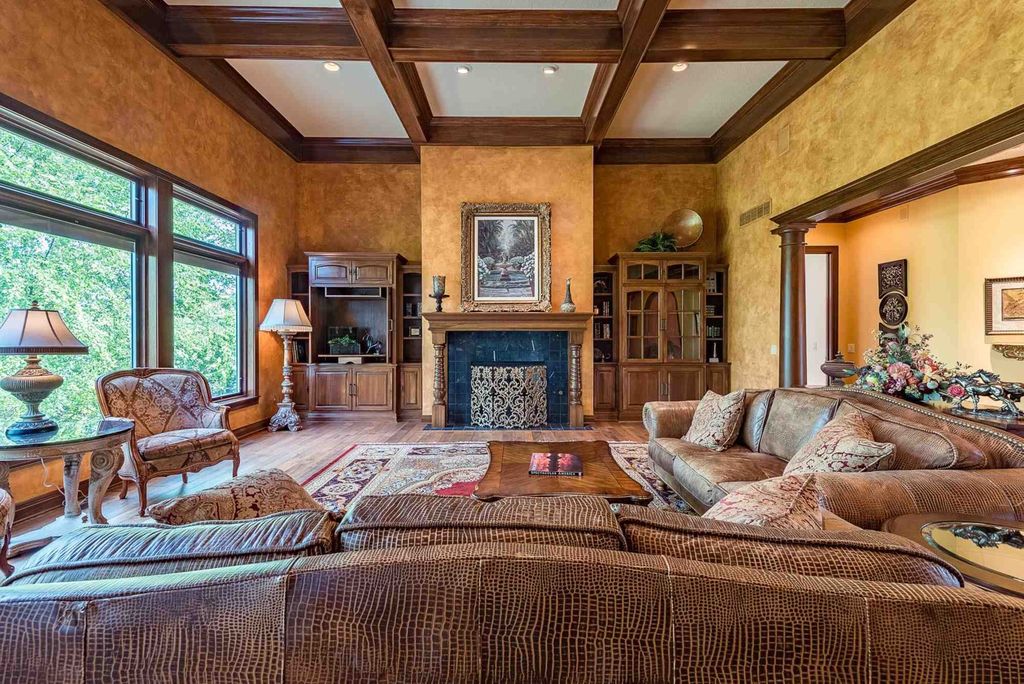 15718 Viberg Road Home in Leo, Indiana. Explore this elegant estate nestled on 11 manicured acres in Leo, IN. With over 11,000 square feet of living space, Venetian plaster walls, hand-scraped wood floors, and custom features throughout, this home offers the ultimate retreat.