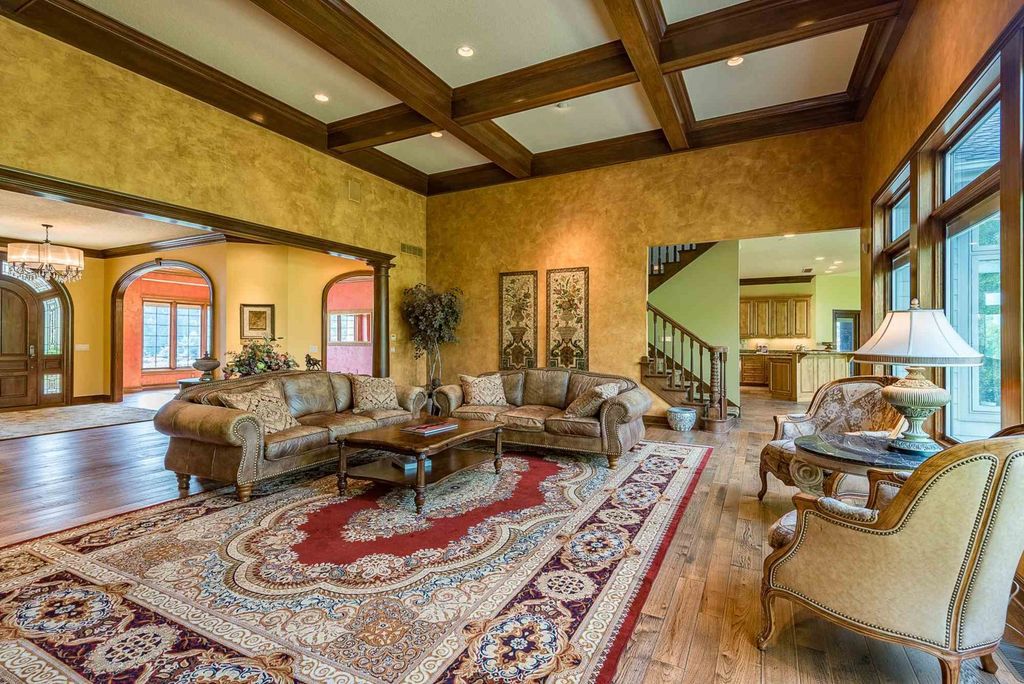 15718 Viberg Road Home in Leo, Indiana. Explore this elegant estate nestled on 11 manicured acres in Leo, IN. With over 11,000 square feet of living space, Venetian plaster walls, hand-scraped wood floors, and custom features throughout, this home offers the ultimate retreat.