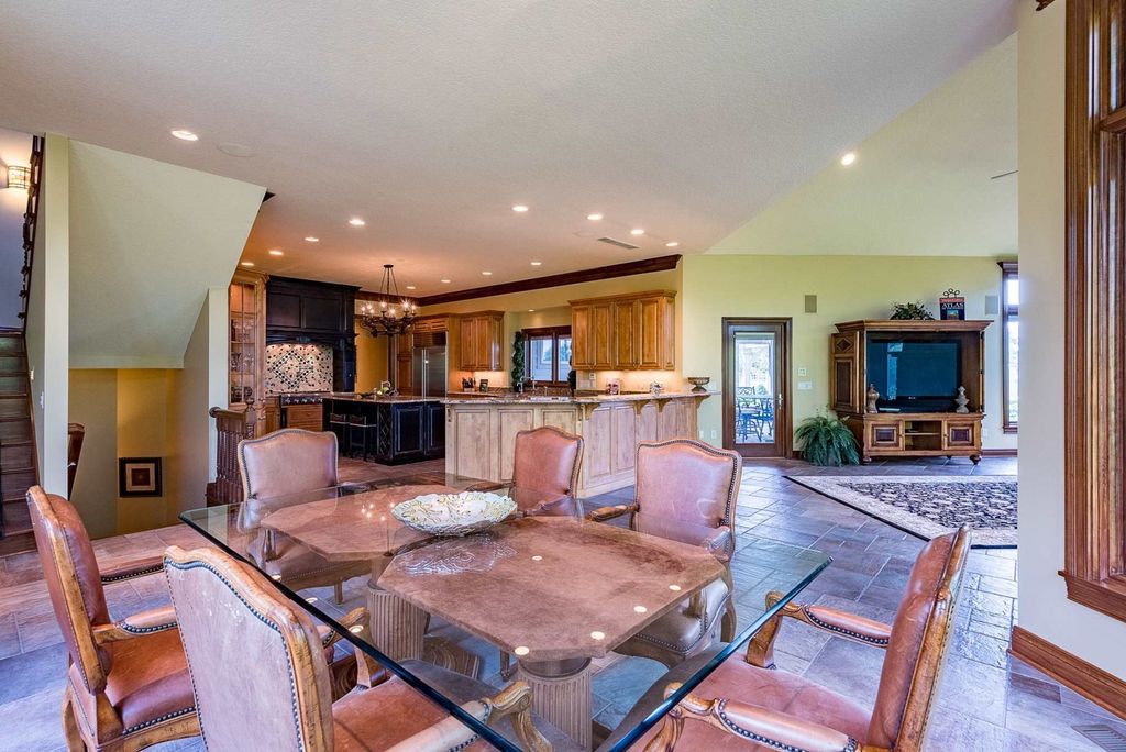 15718 Viberg Road Home in Leo, Indiana. Explore this elegant estate nestled on 11 manicured acres in Leo, IN. With over 11,000 square feet of living space, Venetian plaster walls, hand-scraped wood floors, and custom features throughout, this home offers the ultimate retreat.
