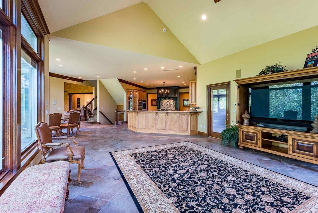 15718 Viberg Road Home in Leo, Indiana. Explore this elegant estate nestled on 11 manicured acres in Leo, IN. With over 11,000 square feet of living space, Venetian plaster walls, hand-scraped wood floors, and custom features throughout, this home offers the ultimate retreat.