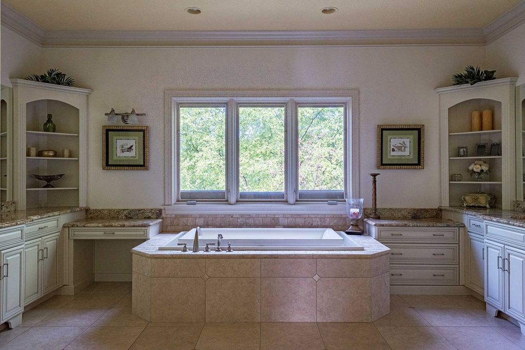 15718 Viberg Road Home in Leo, Indiana. Explore this elegant estate nestled on 11 manicured acres in Leo, IN. With over 11,000 square feet of living space, Venetian plaster walls, hand-scraped wood floors, and custom features throughout, this home offers the ultimate retreat.
