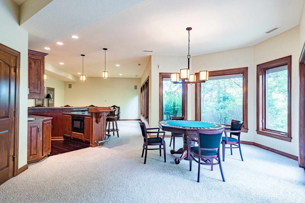 15718 Viberg Road Home in Leo, Indiana. Explore this elegant estate nestled on 11 manicured acres in Leo, IN. With over 11,000 square feet of living space, Venetian plaster walls, hand-scraped wood floors, and custom features throughout, this home offers the ultimate retreat.