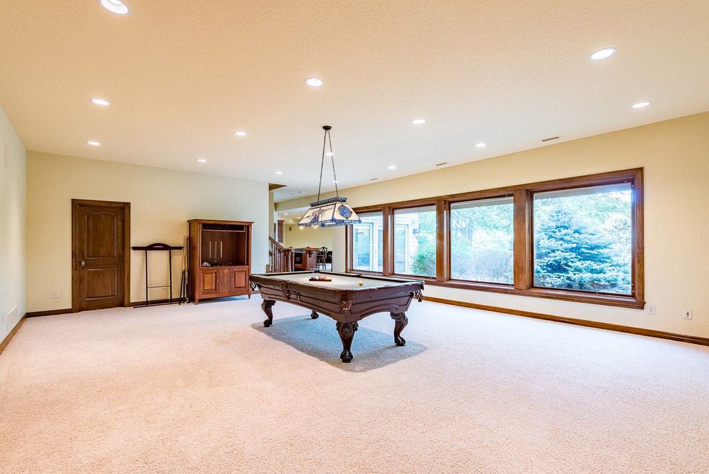 15718 Viberg Road Home in Leo, Indiana. Explore this elegant estate nestled on 11 manicured acres in Leo, IN. With over 11,000 square feet of living space, Venetian plaster walls, hand-scraped wood floors, and custom features throughout, this home offers the ultimate retreat.
