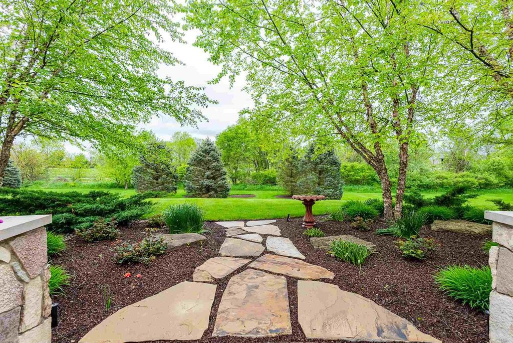 15718 Viberg Road Home in Leo, Indiana. Explore this elegant estate nestled on 11 manicured acres in Leo, IN. With over 11,000 square feet of living space, Venetian plaster walls, hand-scraped wood floors, and custom features throughout, this home offers the ultimate retreat.