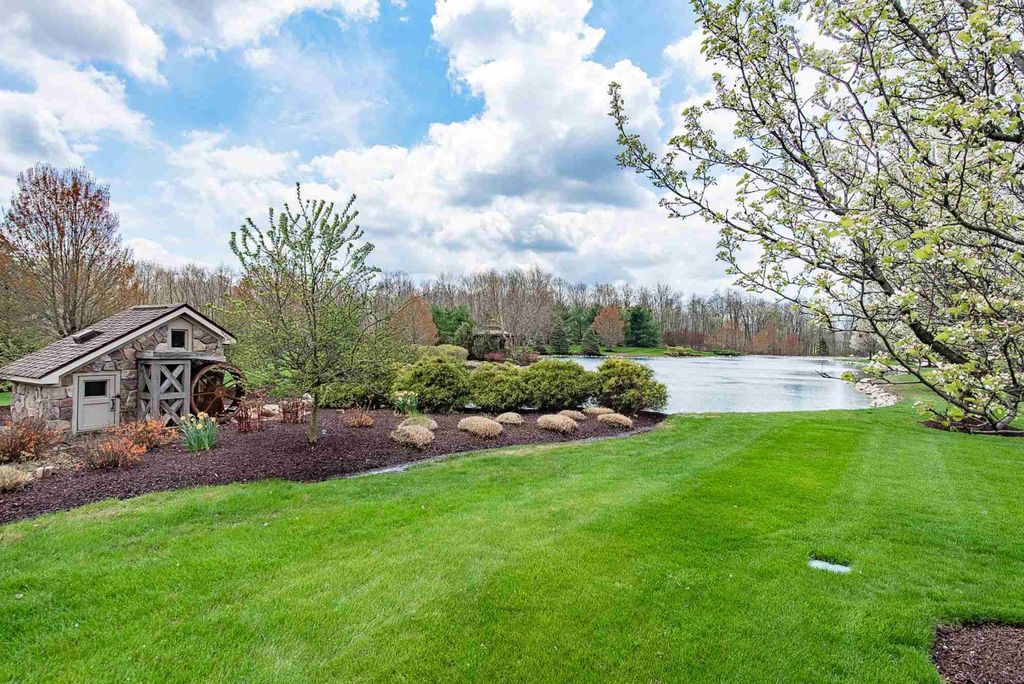 15718 Viberg Road Home in Leo, Indiana. Explore this elegant estate nestled on 11 manicured acres in Leo, IN. With over 11,000 square feet of living space, Venetian plaster walls, hand-scraped wood floors, and custom features throughout, this home offers the ultimate retreat.