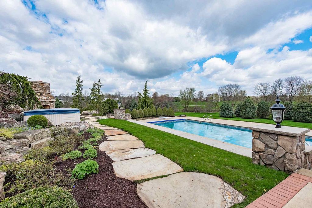 15718 Viberg Road Home in Leo, Indiana. Explore this elegant estate nestled on 11 manicured acres in Leo, IN. With over 11,000 square feet of living space, Venetian plaster walls, hand-scraped wood floors, and custom features throughout, this home offers the ultimate retreat.