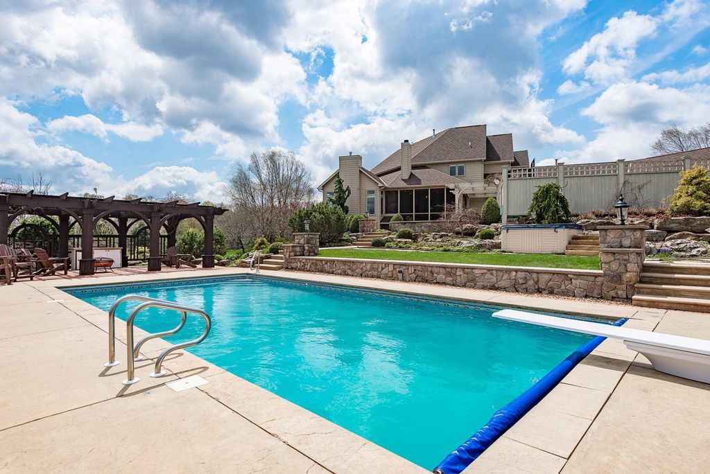 15718 Viberg Road Home in Leo, Indiana. Explore this elegant estate nestled on 11 manicured acres in Leo, IN. With over 11,000 square feet of living space, Venetian plaster walls, hand-scraped wood floors, and custom features throughout, this home offers the ultimate retreat.