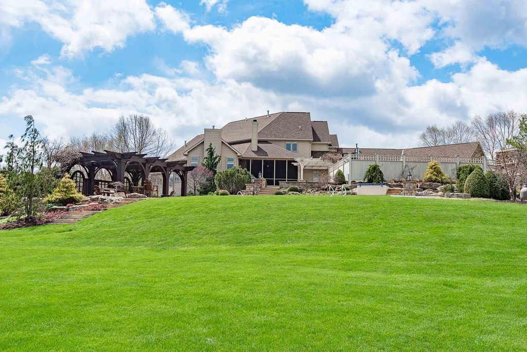 15718 Viberg Road Home in Leo, Indiana. Explore this elegant estate nestled on 11 manicured acres in Leo, IN. With over 11,000 square feet of living space, Venetian plaster walls, hand-scraped wood floors, and custom features throughout, this home offers the ultimate retreat.