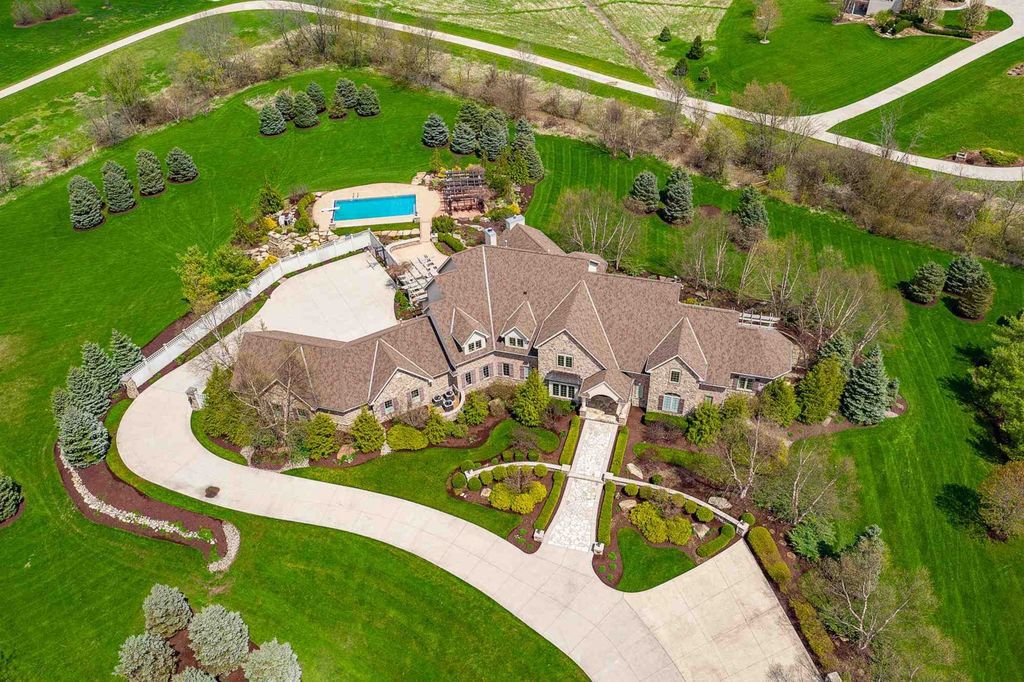 15718 Viberg Road Home in Leo, Indiana. Explore this elegant estate nestled on 11 manicured acres in Leo, IN. With over 11,000 square feet of living space, Venetian plaster walls, hand-scraped wood floors, and custom features throughout, this home offers the ultimate retreat.