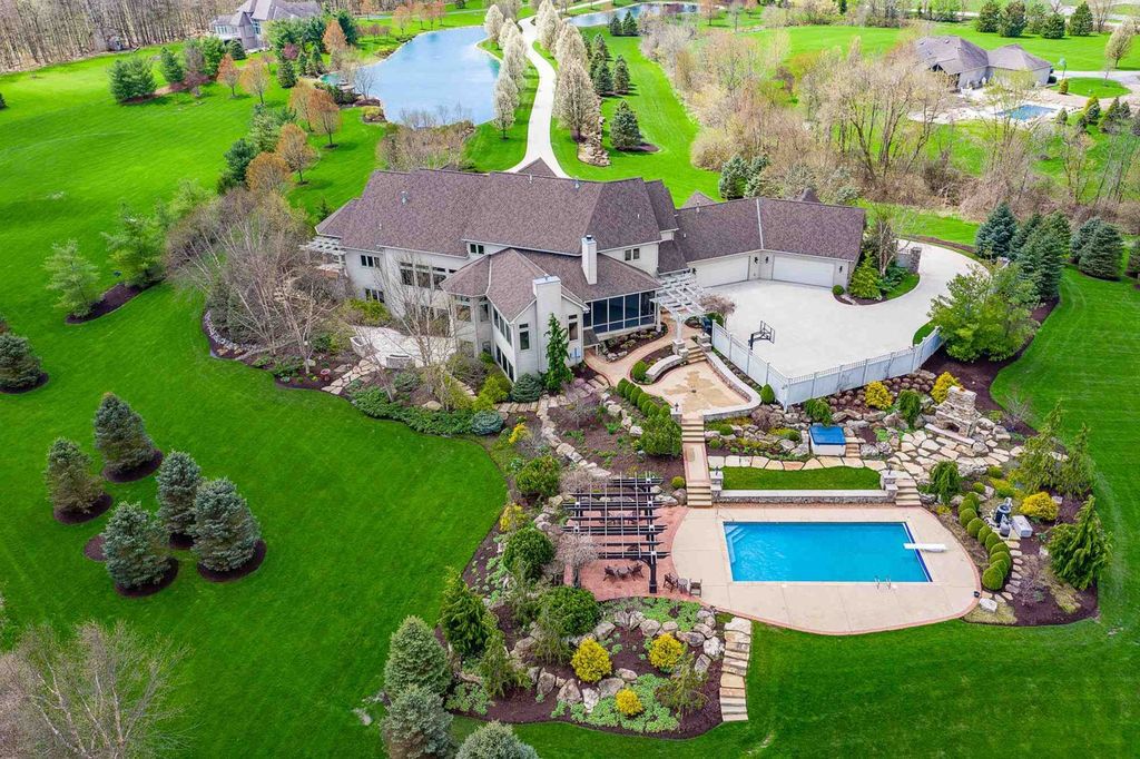 15718 Viberg Road Home in Leo, Indiana. Explore this elegant estate nestled on 11 manicured acres in Leo, IN. With over 11,000 square feet of living space, Venetian plaster walls, hand-scraped wood floors, and custom features throughout, this home offers the ultimate retreat.