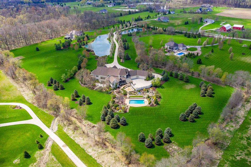 15718 Viberg Road Home in Leo, Indiana. Explore this elegant estate nestled on 11 manicured acres in Leo, IN. With over 11,000 square feet of living space, Venetian plaster walls, hand-scraped wood floors, and custom features throughout, this home offers the ultimate retreat.