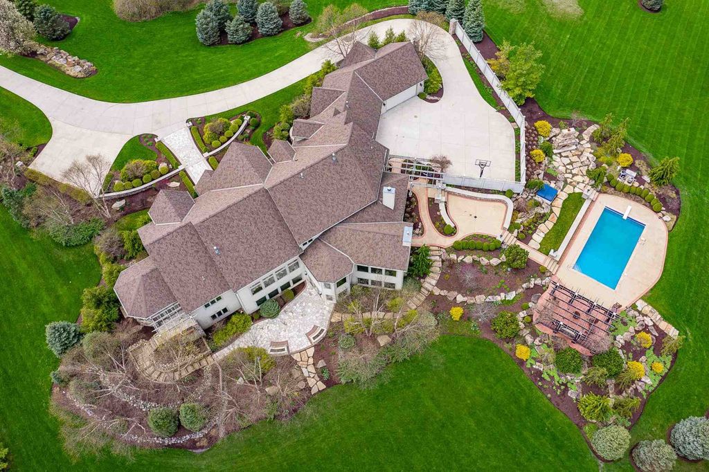 15718 Viberg Road Home in Leo, Indiana. Explore this elegant estate nestled on 11 manicured acres in Leo, IN. With over 11,000 square feet of living space, Venetian plaster walls, hand-scraped wood floors, and custom features throughout, this home offers the ultimate retreat.