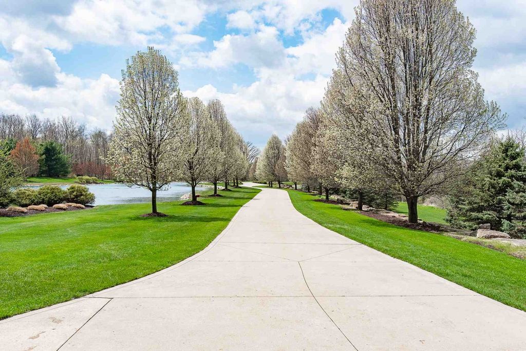 15718 Viberg Road Home in Leo, Indiana. Explore this elegant estate nestled on 11 manicured acres in Leo, IN. With over 11,000 square feet of living space, Venetian plaster walls, hand-scraped wood floors, and custom features throughout, this home offers the ultimate retreat.