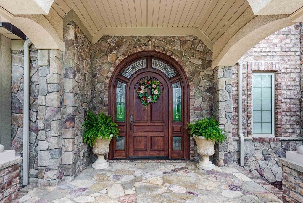 15718 Viberg Road Home in Leo, Indiana. Explore this elegant estate nestled on 11 manicured acres in Leo, IN. With over 11,000 square feet of living space, Venetian plaster walls, hand-scraped wood floors, and custom features throughout, this home offers the ultimate retreat.
