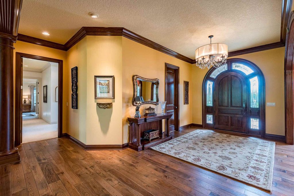 15718 Viberg Road Home in Leo, Indiana. Explore this elegant estate nestled on 11 manicured acres in Leo, IN. With over 11,000 square feet of living space, Venetian plaster walls, hand-scraped wood floors, and custom features throughout, this home offers the ultimate retreat.