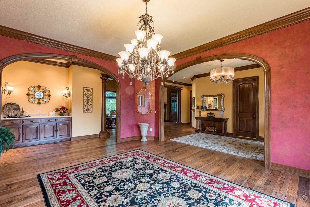 15718 Viberg Road Home in Leo, Indiana. Explore this elegant estate nestled on 11 manicured acres in Leo, IN. With over 11,000 square feet of living space, Venetian plaster walls, hand-scraped wood floors, and custom features throughout, this home offers the ultimate retreat.