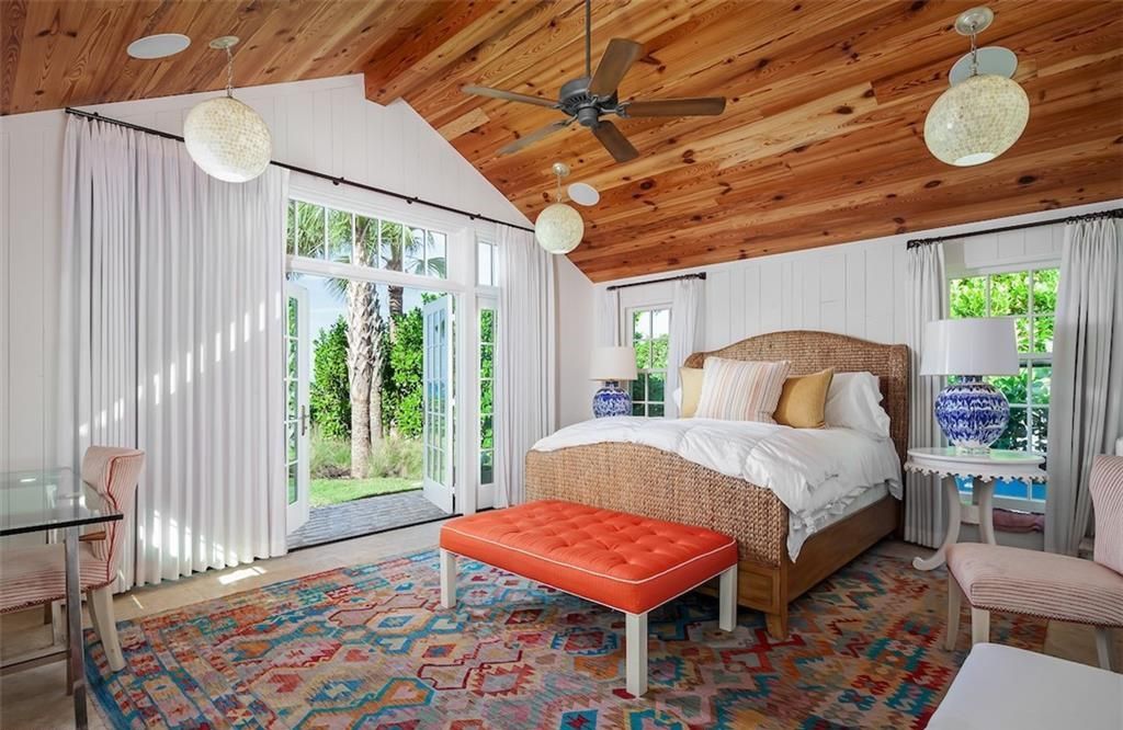 Nestled on nearly half an acre of prime beachfront land in Olde Naples, this exceptional home seamlessly blends coastal elegance with timeless craftsmanship.