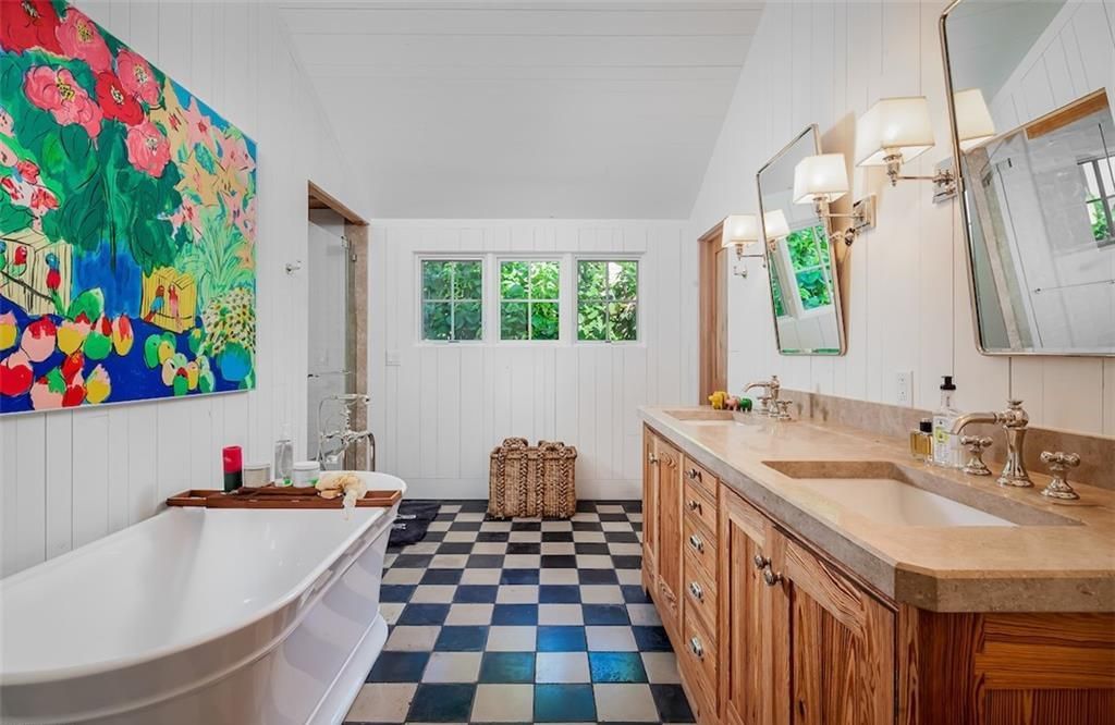 Nestled on nearly half an acre of prime beachfront land in Olde Naples, this exceptional home seamlessly blends coastal elegance with timeless craftsmanship.