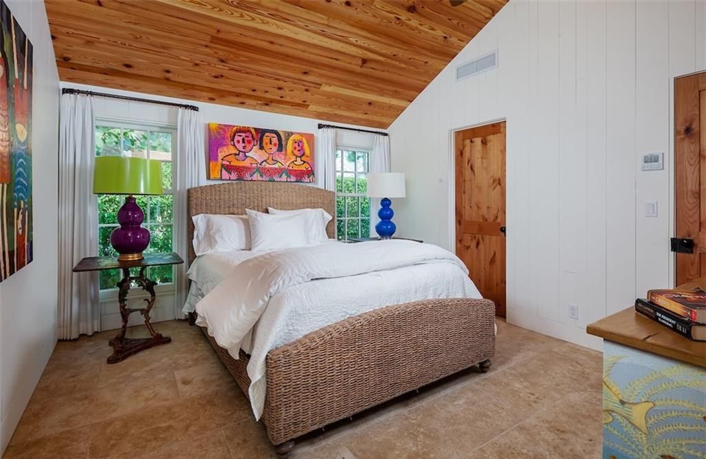 Nestled on nearly half an acre of prime beachfront land in Olde Naples, this exceptional home seamlessly blends coastal elegance with timeless craftsmanship.