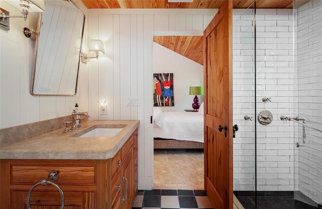 Nestled on nearly half an acre of prime beachfront land in Olde Naples, this exceptional home seamlessly blends coastal elegance with timeless craftsmanship.