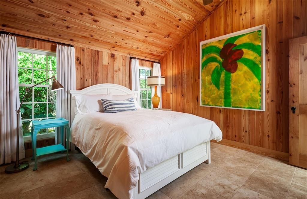 Nestled on nearly half an acre of prime beachfront land in Olde Naples, this exceptional home seamlessly blends coastal elegance with timeless craftsmanship.