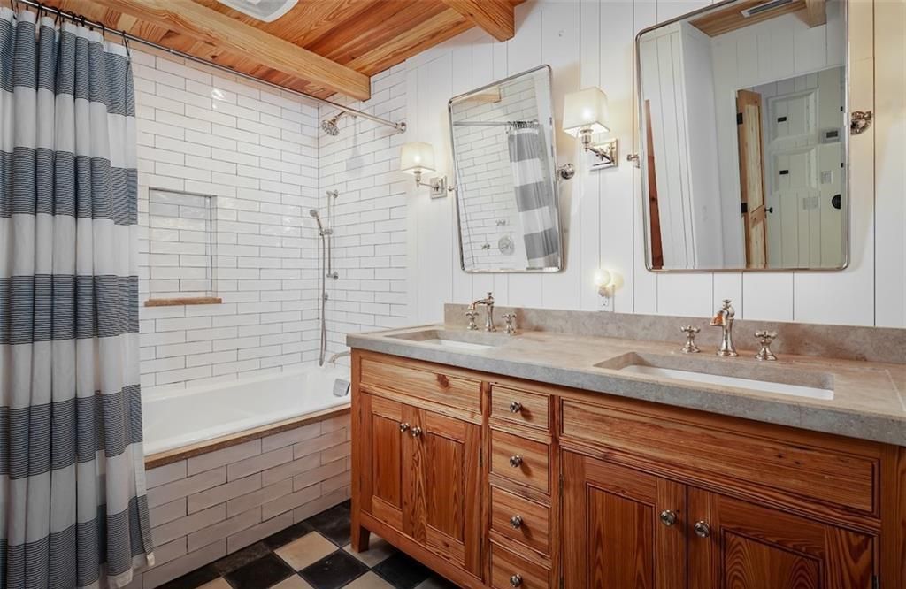 Nestled on nearly half an acre of prime beachfront land in Olde Naples, this exceptional home seamlessly blends coastal elegance with timeless craftsmanship.