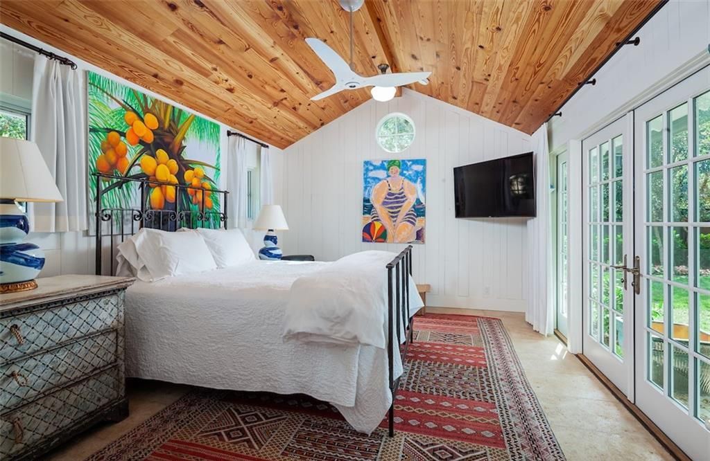 Nestled on nearly half an acre of prime beachfront land in Olde Naples, this exceptional home seamlessly blends coastal elegance with timeless craftsmanship.