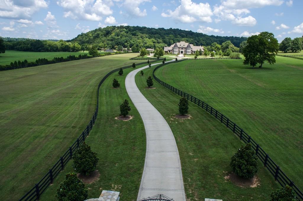 This stunning 20-acre gated estate is in the coveted and bucolic community of Leiper’s Fork in Williamson County. The grand entry features soaring 23-foot ceilings, marble floors and double sweeping staircases. It’s high drama teamed with luxurious beauty. The home has four bedrooms, six full and three half-baths. 3320 Southall Rd, Franklin, TN.