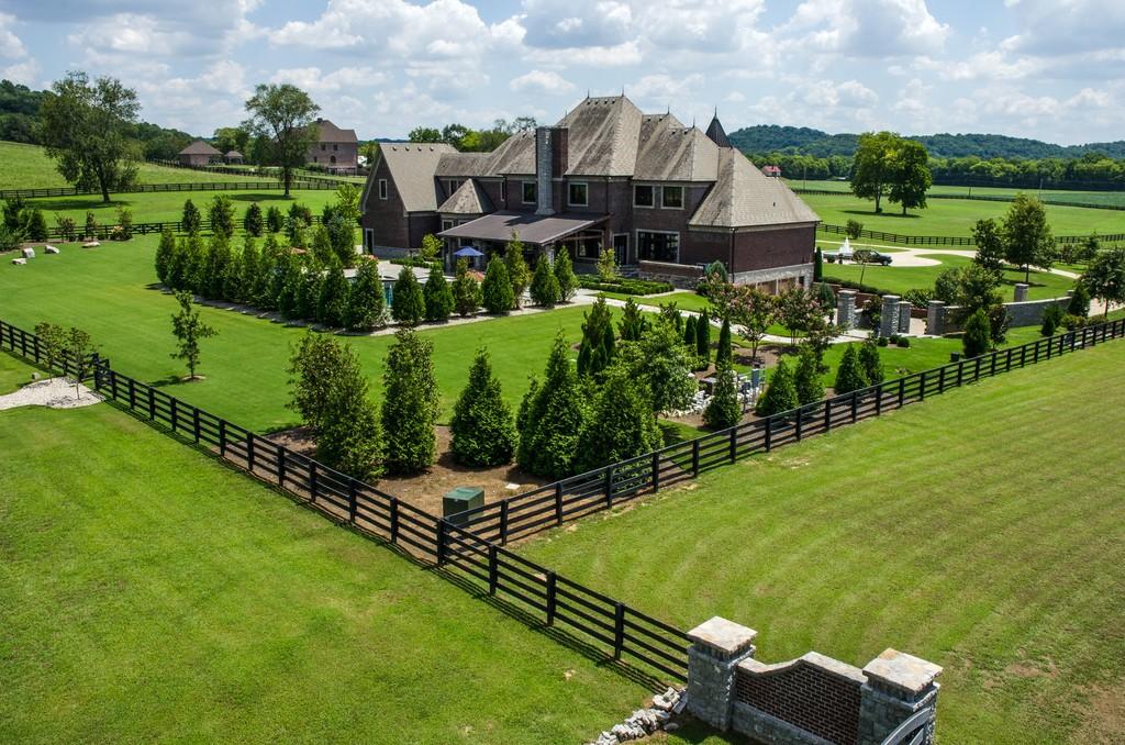This stunning 20-acre gated estate is in the coveted and bucolic community of Leiper’s Fork in Williamson County. The grand entry features soaring 23-foot ceilings, marble floors and double sweeping staircases. It’s high drama teamed with luxurious beauty. The home has four bedrooms, six full and three half-baths. 3320 Southall Rd, Franklin, TN.