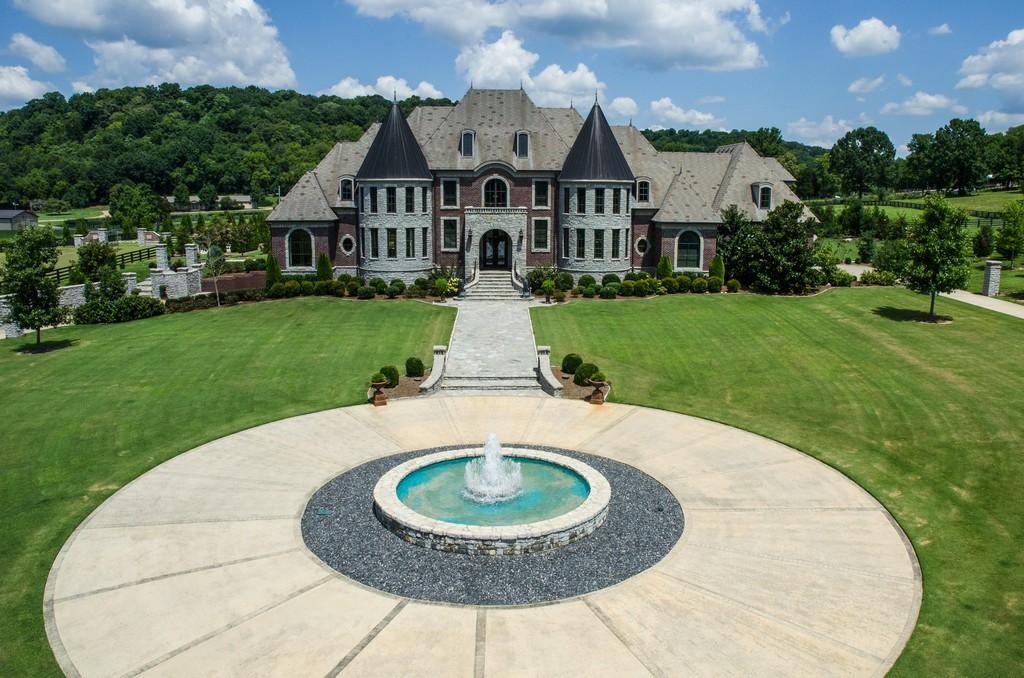 This stunning 20-acre gated estate is in the coveted and bucolic community of Leiper’s Fork in Williamson County. The grand entry features soaring 23-foot ceilings, marble floors and double sweeping staircases. It’s high drama teamed with luxurious beauty. The home has four bedrooms, six full and three half-baths. 3320 Southall Rd, Franklin, TN.