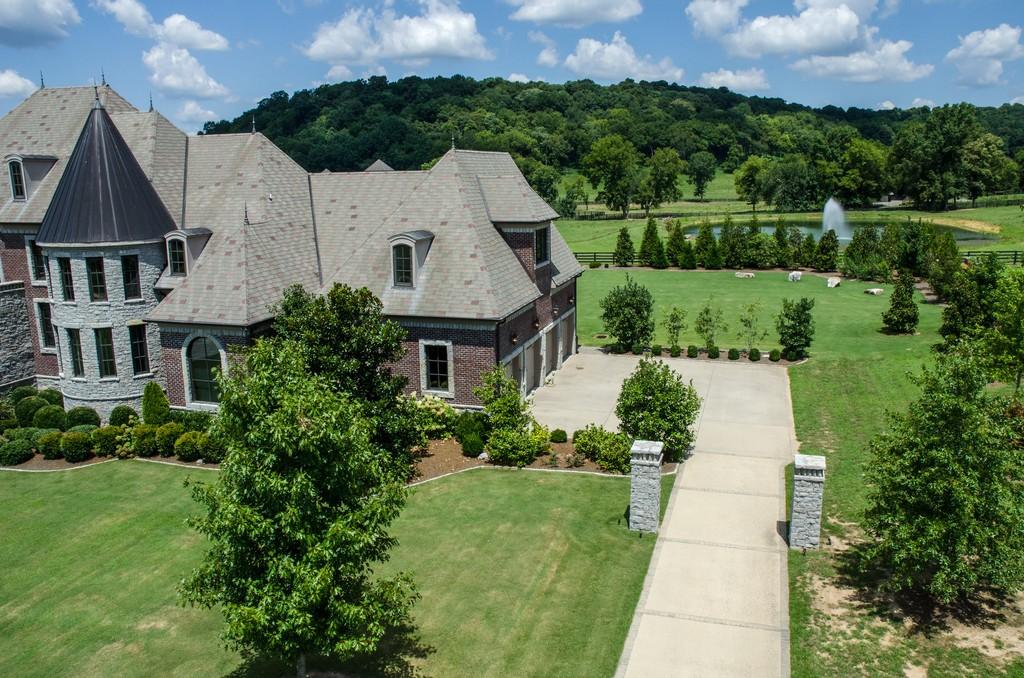 This stunning 20-acre gated estate is in the coveted and bucolic community of Leiper’s Fork in Williamson County. The grand entry features soaring 23-foot ceilings, marble floors and double sweeping staircases. It’s high drama teamed with luxurious beauty. The home has four bedrooms, six full and three half-baths. 3320 Southall Rd, Franklin, TN.