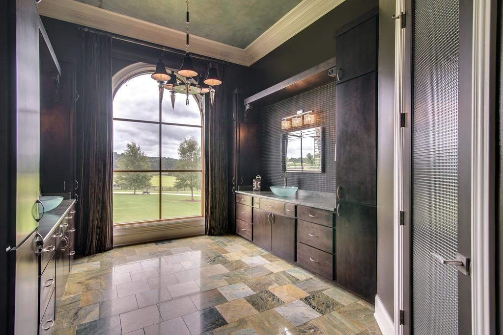 This stunning 20-acre gated estate is in the coveted and bucolic community of Leiper’s Fork in Williamson County. The grand entry features soaring 23-foot ceilings, marble floors and double sweeping staircases. It’s high drama teamed with luxurious beauty. The home has four bedrooms, six full and three half-baths. 3320 Southall Rd, Franklin, TN.