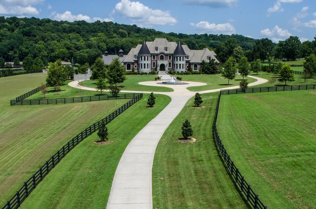 This stunning 20-acre gated estate is in the coveted and bucolic community of Leiper’s Fork in Williamson County. The grand entry features soaring 23-foot ceilings, marble floors and double sweeping staircases. It’s high drama teamed with luxurious beauty. The home has four bedrooms, six full and three half-baths. 3320 Southall Rd, Franklin, TN.