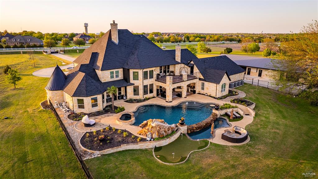 5297 South Farm 549 Home in Rockwall, Texas. Discover this exquisite 12.5-acre estate in Rockwall, boasting over 7100 sqft of luxury living space, 5 beds, 4.3 baths, and unparalleled amenities. Ideal for equestrian enthusiasts and car lovers alike, the property features a 3-stall horse barn, 5-car attached garages.