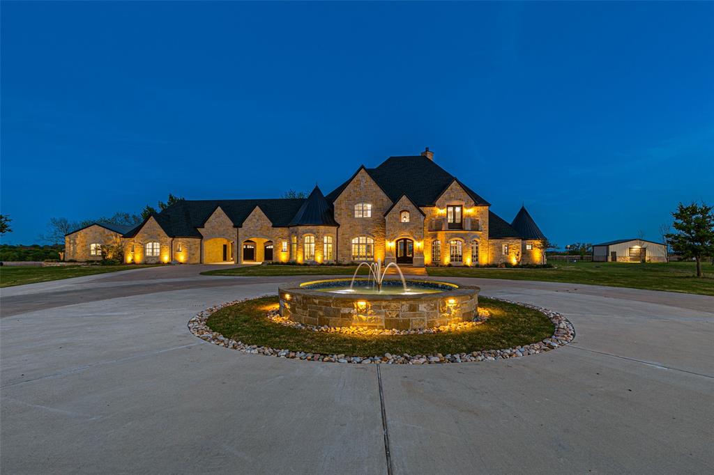 5297 South Farm 549 Home in Rockwall, Texas. Discover this exquisite 12.5-acre estate in Rockwall, boasting over 7100 sqft of luxury living space, 5 beds, 4.3 baths, and unparalleled amenities. Ideal for equestrian enthusiasts and car lovers alike, the property features a 3-stall horse barn, 5-car attached garages.