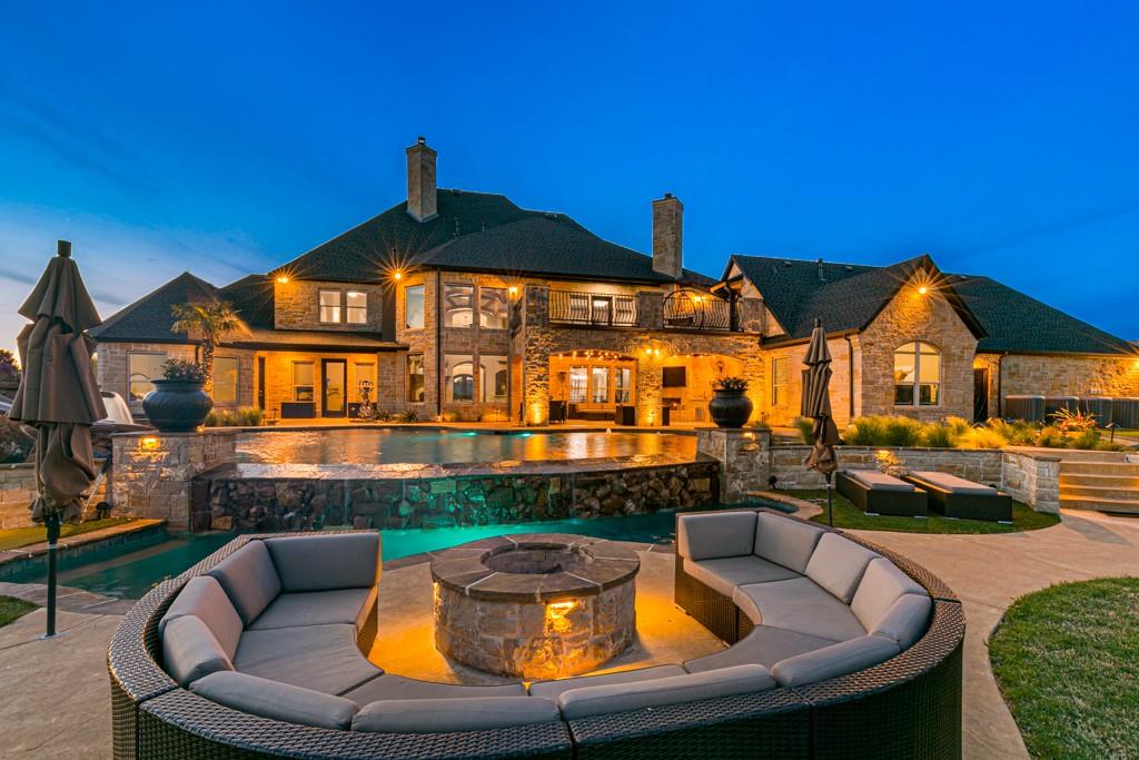 5297 South Farm 549 Home in Rockwall, Texas. Discover this exquisite 12.5-acre estate in Rockwall, boasting over 7100 sqft of luxury living space, 5 beds, 4.3 baths, and unparalleled amenities. Ideal for equestrian enthusiasts and car lovers alike, the property features a 3-stall horse barn, 5-car attached garages.