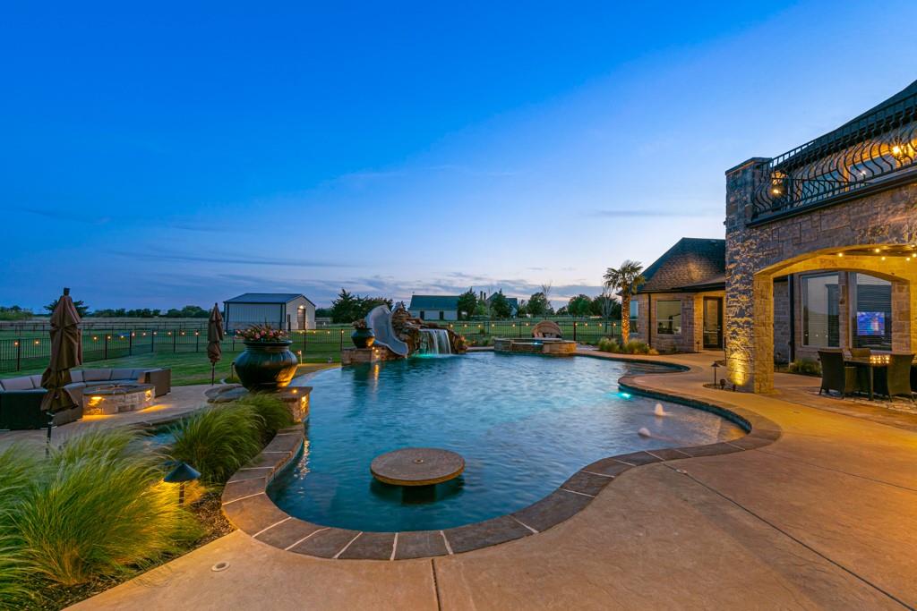 5297 South Farm 549 Home in Rockwall, Texas. Discover this exquisite 12.5-acre estate in Rockwall, boasting over 7100 sqft of luxury living space, 5 beds, 4.3 baths, and unparalleled amenities. Ideal for equestrian enthusiasts and car lovers alike, the property features a 3-stall horse barn, 5-car attached garages.