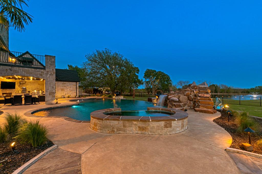 5297 South Farm 549 Home in Rockwall, Texas. Discover this exquisite 12.5-acre estate in Rockwall, boasting over 7100 sqft of luxury living space, 5 beds, 4.3 baths, and unparalleled amenities. Ideal for equestrian enthusiasts and car lovers alike, the property features a 3-stall horse barn, 5-car attached garages.