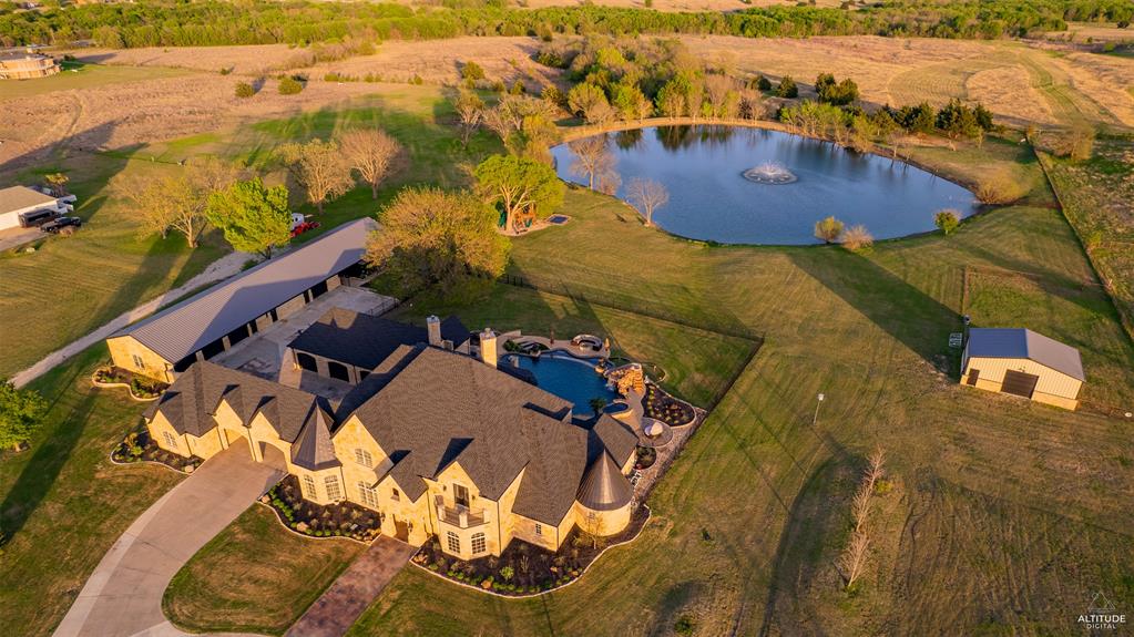 5297 South Farm 549 Home in Rockwall, Texas. Discover this exquisite 12.5-acre estate in Rockwall, boasting over 7100 sqft of luxury living space, 5 beds, 4.3 baths, and unparalleled amenities. Ideal for equestrian enthusiasts and car lovers alike, the property features a 3-stall horse barn, 5-car attached garages.