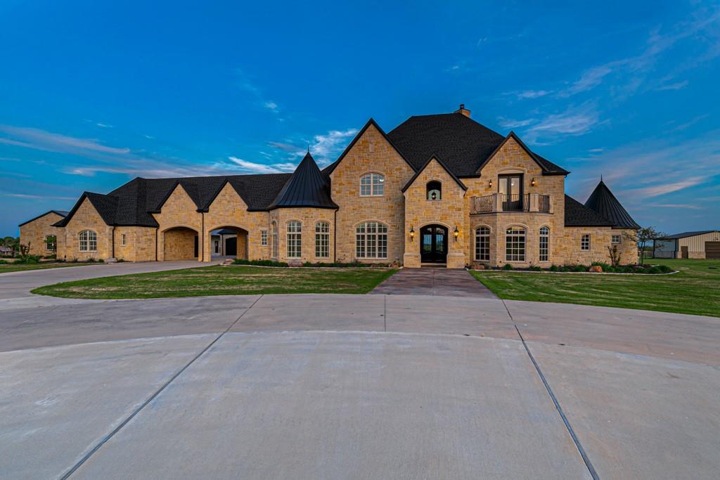 5297 South Farm 549 Home in Rockwall, Texas. Discover this exquisite 12.5-acre estate in Rockwall, boasting over 7100 sqft of luxury living space, 5 beds, 4.3 baths, and unparalleled amenities. Ideal for equestrian enthusiasts and car lovers alike, the property features a 3-stall horse barn, 5-car attached garages.