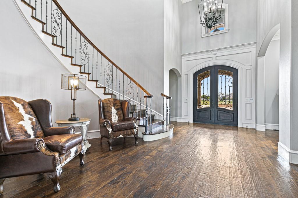 5297 South Farm 549 Home in Rockwall, Texas. Discover this exquisite 12.5-acre estate in Rockwall, boasting over 7100 sqft of luxury living space, 5 beds, 4.3 baths, and unparalleled amenities. Ideal for equestrian enthusiasts and car lovers alike, the property features a 3-stall horse barn, 5-car attached garages.