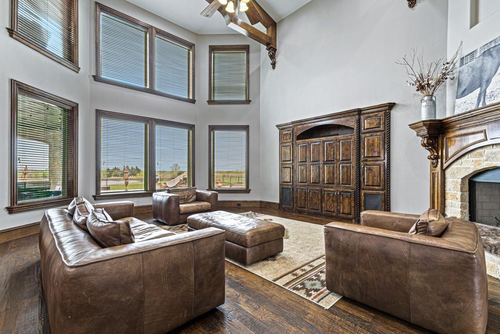 5297 South Farm 549 Home in Rockwall, Texas. Discover this exquisite 12.5-acre estate in Rockwall, boasting over 7100 sqft of luxury living space, 5 beds, 4.3 baths, and unparalleled amenities. Ideal for equestrian enthusiasts and car lovers alike, the property features a 3-stall horse barn, 5-car attached garages.