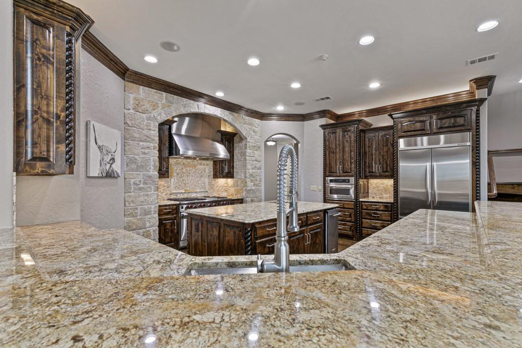 5297 South Farm 549 Home in Rockwall, Texas. Discover this exquisite 12.5-acre estate in Rockwall, boasting over 7100 sqft of luxury living space, 5 beds, 4.3 baths, and unparalleled amenities. Ideal for equestrian enthusiasts and car lovers alike, the property features a 3-stall horse barn, 5-car attached garages.