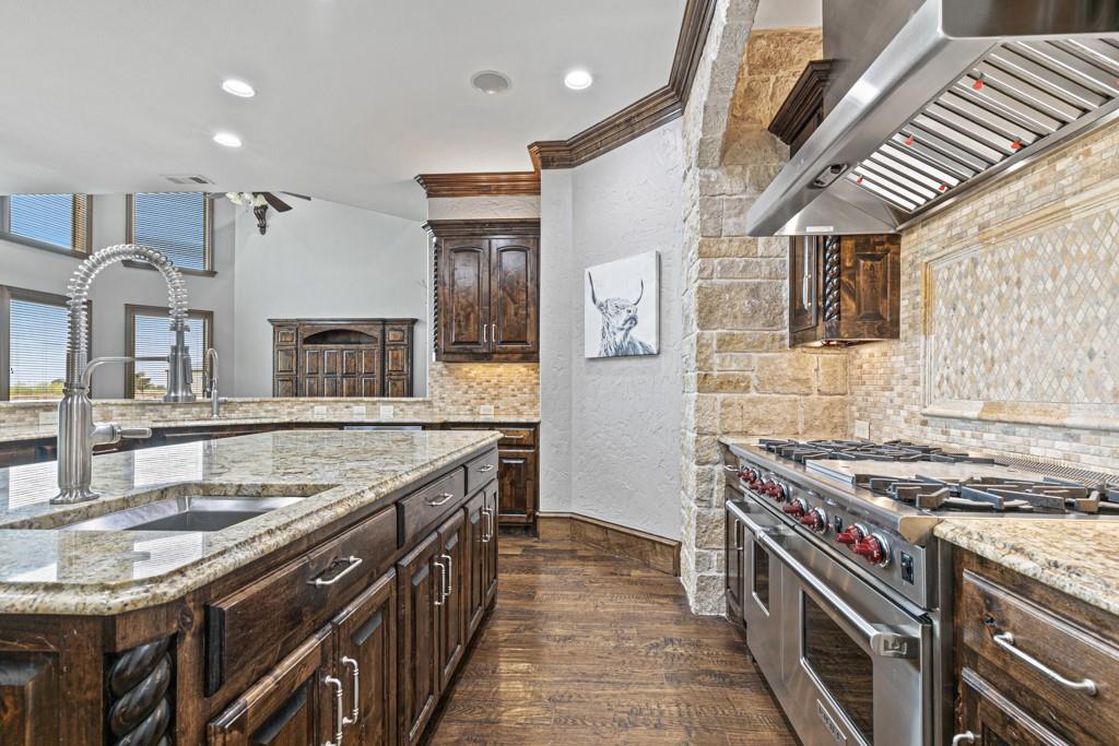 5297 South Farm 549 Home in Rockwall, Texas. Discover this exquisite 12.5-acre estate in Rockwall, boasting over 7100 sqft of luxury living space, 5 beds, 4.3 baths, and unparalleled amenities. Ideal for equestrian enthusiasts and car lovers alike, the property features a 3-stall horse barn, 5-car attached garages.
