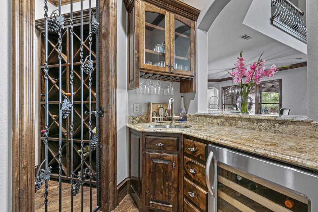5297 South Farm 549 Home in Rockwall, Texas. Discover this exquisite 12.5-acre estate in Rockwall, boasting over 7100 sqft of luxury living space, 5 beds, 4.3 baths, and unparalleled amenities. Ideal for equestrian enthusiasts and car lovers alike, the property features a 3-stall horse barn, 5-car attached garages.