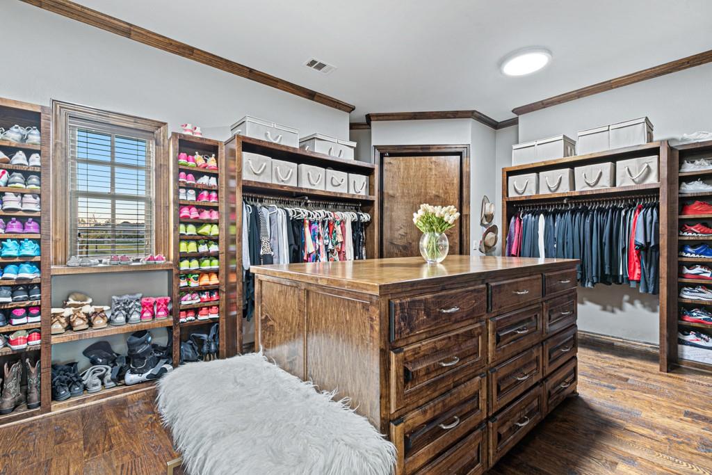 5297 South Farm 549 Home in Rockwall, Texas. Discover this exquisite 12.5-acre estate in Rockwall, boasting over 7100 sqft of luxury living space, 5 beds, 4.3 baths, and unparalleled amenities. Ideal for equestrian enthusiasts and car lovers alike, the property features a 3-stall horse barn, 5-car attached garages.