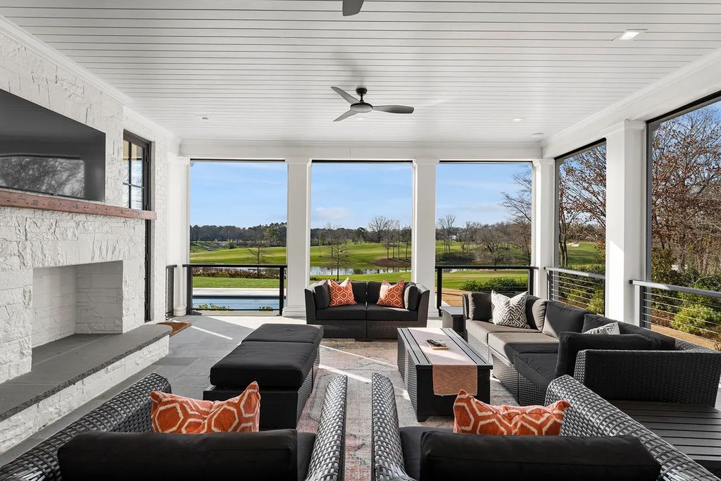 7214 Baltusrol Lane Home in Charlotte, North Carolina. Discover unparalleled luxury living at "Satisfaction In Charlotte," a meticulously renovated estate offering breathtaking views of Quail Hollow's premier golf course. This turn-key home boasts top-to-bottom renovations by Peters Custom Homes, including a culinary masterpiece kitchen, indulgent primary suite with private balcony, and seamless indoor-outdoor living spaces perfect for entertaining.
