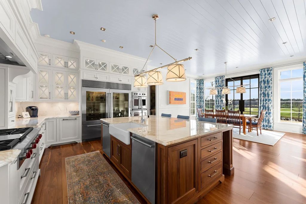 7214 Baltusrol Lane Home in Charlotte, North Carolina. Discover unparalleled luxury living at "Satisfaction In Charlotte," a meticulously renovated estate offering breathtaking views of Quail Hollow's premier golf course. This turn-key home boasts top-to-bottom renovations by Peters Custom Homes, including a culinary masterpiece kitchen, indulgent primary suite with private balcony, and seamless indoor-outdoor living spaces perfect for entertaining.