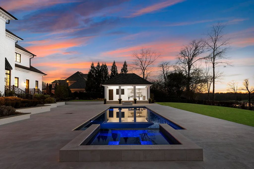7214 Baltusrol Lane Home in Charlotte, North Carolina. Discover unparalleled luxury living at "Satisfaction In Charlotte," a meticulously renovated estate offering breathtaking views of Quail Hollow's premier golf course. This turn-key home boasts top-to-bottom renovations by Peters Custom Homes, including a culinary masterpiece kitchen, indulgent primary suite with private balcony, and seamless indoor-outdoor living spaces perfect for entertaining.
